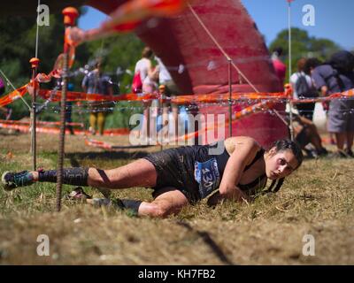 Photos taken in the race Eternal Running 2017 in Pallaresos, Tarragona, Spain.Young athletes females in passing one of the hundreds of obstacles. Stock Photo