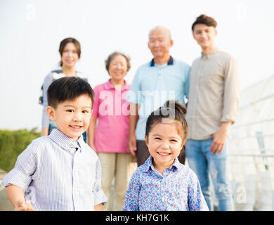 Multi-generation family having fun together outdoors Stock Photo