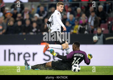 Cologne, Germany. 14th Nov, 2017. Germany's Timo Werner fails against France's goalkeeper Steve Mandanda during the international soccer match between Germany and France in Cologne, Germany, 14 November 2017. Credit: Marius Becker/dpa/Alamy Live News Stock Photo