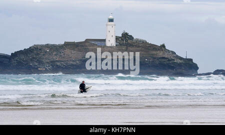 St Ives Cornwall UK 15th November 2017 -  Surfers make the most of the waves off Godrevy beach near St Ives in Cornwall today Photograph taken by Simon Dack Credit: Simon Dack/Alamy Live News Stock Photo