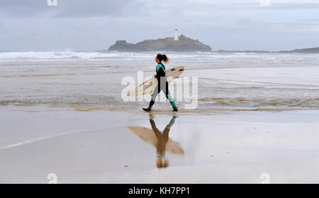 St Ives Cornwall UK 15th November 2017 -  Surfers make the most of the waves off Godrevy beach near St Ives in Cornwall today Photograph taken by Simon Dack Credit: Simon Dack/Alamy Live News Stock Photo