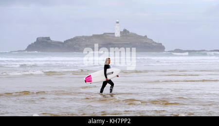 St Ives Cornwall UK 15th November 2017 -  Surfers make the most of the waves off Godrevy beach near St Ives in Cornwall today Photograph taken by Simon Dack Credit: Simon Dack/Alamy Live News Stock Photo