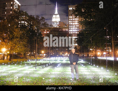 Manhattan, New York, USA. 14th Nov, 2017. The Austrian artist Erwin Redl stands in his installation 'Whiteout' on the grass of the Madison Square Park in Manhattan, New York, US, 14 November 2017. Hundreds of LED lights are meant to illuminate the park during the winter months. Credit: Johannes Schmitt-Tegge/dpa/Alamy Live News Stock Photo