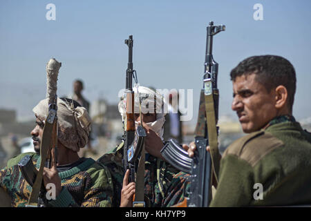 Sanaa, Yemen. 16th Nov, 2017. Houthi rebel fighters display their weapons during a gathering aimed at mobilizing more fighters before heading to battlefronts in Sanaa, Yemen, 16 November 2017. According to the international aid group Save the Children the ongoing war in the country takes a particular heavy toll on the youngest, with approximately 120 children dying every day. The group says already over 50,000 children are believed to have died in 2017. Credit: Hani Al-Ansi/dpa/Alamy Live News Stock Photo