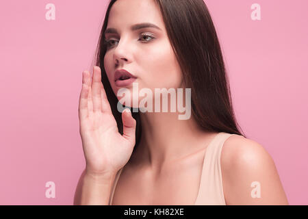 Young woman shout and scream using her hands Stock Photo