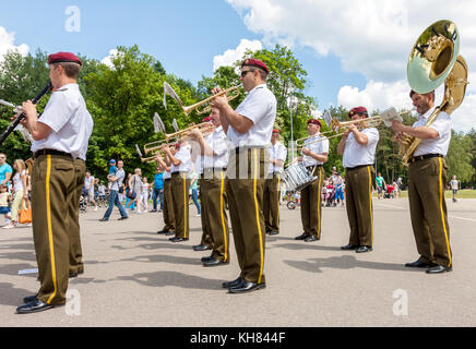 Military brass big band dressed in uniform playing on the street in Vilnius, Lithuania
