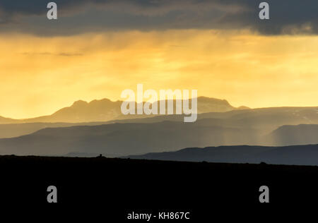 Colorful sunset over mountains. Fantastic view of layered icelandic landscape. Iceland. Stock Photo