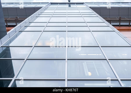 Close-up multi-storey office building with mirror windows. Lower angle shot. Stock Photo
