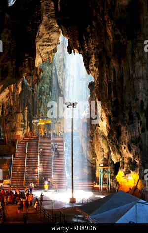 sunbeam through the karstic limestone in Batu Caves, Malaysia, this is a tourist attraction and holy place for Hindu devotees especially during Thsipu Stock Photo