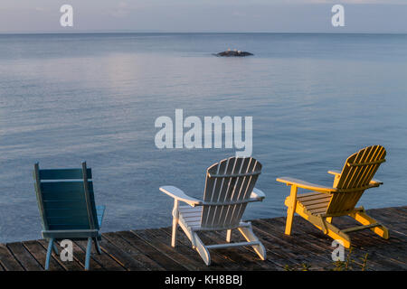 Wood chairs overlooking North Channel, Blind River, Ontario, Canada Stock Photo