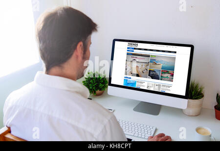 Man surfing internet on computer Stock Photo
