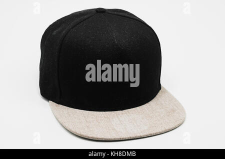 Black cap with light gray flap isolated on white. Straight flap cap with no brand. Stock Photo