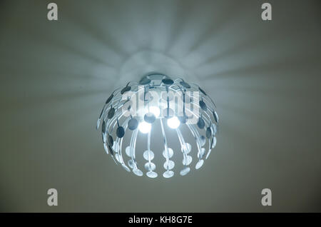 Chandelier Ceiling and Lights are on, decorative hanging light with branches Stock Photo