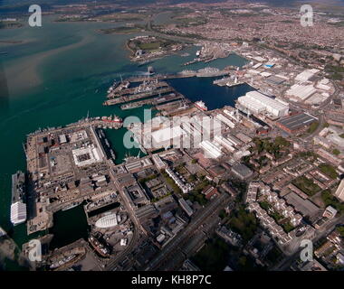 AJAXNETPHOTO.24TH AUGUST, 2011. PORTSMOUTH, ENGLAND. - BIRD'S EYE VIEW - THE CITY'S SPRAWLING NAVAL BASE, (AIRCRAFT CARRIER INVINCIBLE ALONGSIDE LEFT), FERRY PORT AND NORTHERN SUBURBS. PHOTO:JONATHAN EASTLAND/AJAX REF:GR111006 13041 Stock Photo