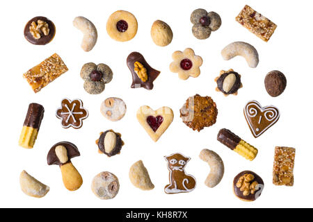 Collection of traditional homemade Christmas cookies. Various shapes and types of sweet pastries. Isolated on white background. Stock Photo