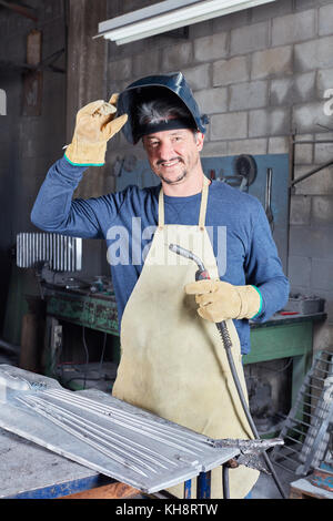 Man as experienced welder with competence in metallurgy workshop Stock Photo