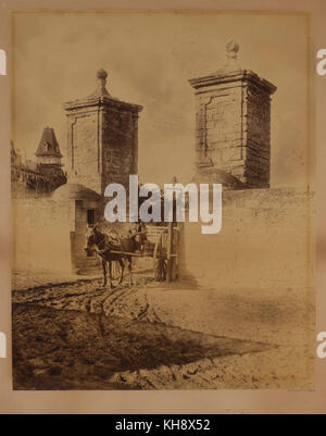 Portrait of Man Sitting in Horse-Drawn Cart at Street Entrance, Orange Street, Saint Augustine, Florida, USA, by George Baker, 1886 Stock Photo