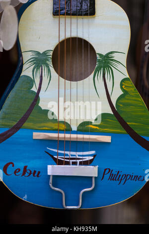 Asia, Philippines, Cebu, Mactan, Mactan Shrine, Souvenir guitars and ukuleles. Cebu is famous for the production of guitars Stock Photo