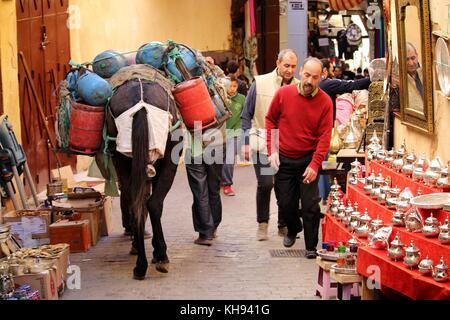 Fez, Morocco - November 8, 2017: People walking through the medina of Fez, the biggest urban zone without traffic in the world. Credit: Dino Geromella Stock Photo