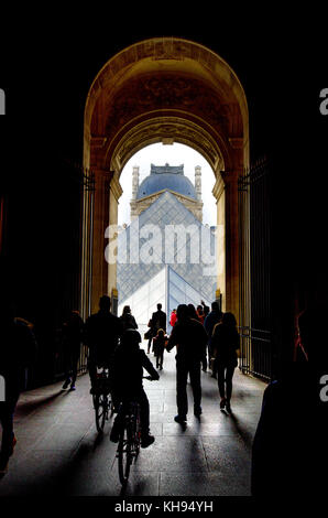 Paris, France. Palais du Louvre. Archway leading to Cour Napoleon and the Pyramid Stock Photo