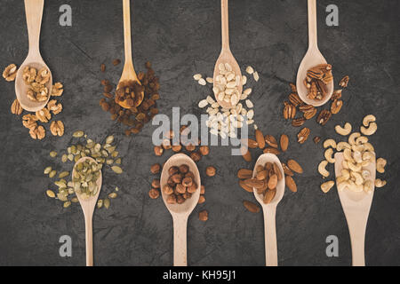 assorted nuts in spoons Stock Photo