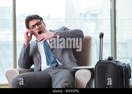 Young businessman in airport business lounge waiting for flight Stock Photo