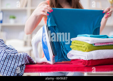 Woman wife doing ironing at home Stock Photo