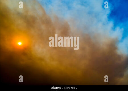 Cloudscape sky with smoke from fire. Stock Photo