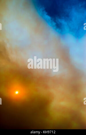 Cloudscape sky with smoke from fire. Stock Photo