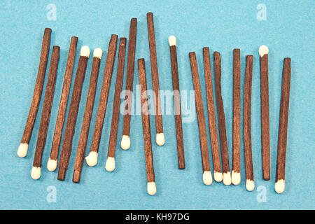Black wooden matches isolated on blue Stock Photo