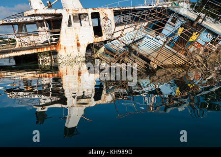 Damaged, wrecked and abandoned boats in Port Vila harbour a year after Cyclone Pam. (Cyclone not necessarily responsible for all shipwrecks.)  Vanuatu Stock Photo