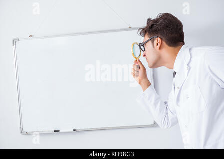 Funny doctor scientist making presentation in hospital Stock Photo