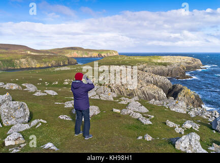 dh Nts island BU NESS FAIR ISLE Birdwatcher binoculars watching for birds sea cliffs bird watcher twitching scottish islands scotland isles