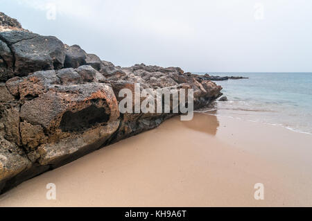 volcanic formations in Montaña Amarilla Beach (playa de la Cocina) in a cloudy day, La Graciosa, Canary Islands, Spain Stock Photo