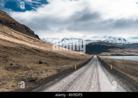 Looking down a dirt road in Iceland Stock Photo