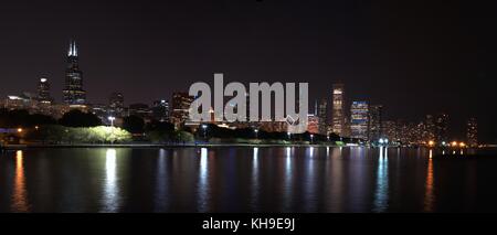 Chicago night skyline across Lake Michigan with fireworks Stock Photo ...
