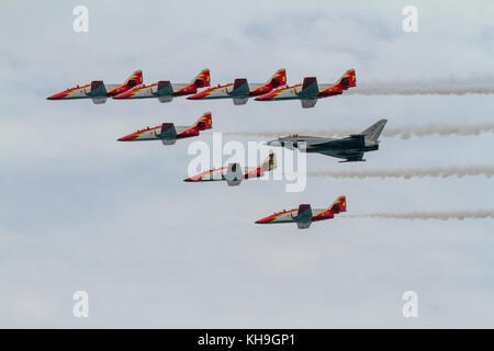 TORRE DEL MAR, MALAGA, SPAIN-JUL 31: Aircraft CASA C-101 of the Patrulla Aguila and Eurofighter Typhoon EF-2000 taking part in a exhibition on the 1st Stock Photo