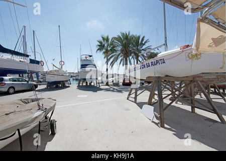 SA RAPITA, MALLORCA, BALEARIC ISLANDS, SPAIN - OCTOBER 6, 2017: Boats up for winter repair in the harbor on a sunny day on October 6, 2017 in Sa Rapit Stock Photo