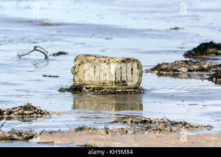 Discarded plastic products washed up on to Southport beach in Merseyside. Stock Photo