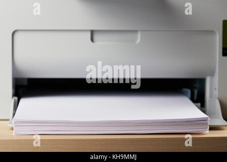 Loading paper in printer tray close up concept Stock Photo
