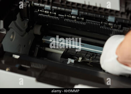 Checking modern printer mechanism. Repair printer service Stock Photo