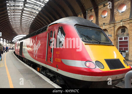 Virgin Trains high speed passenger train waiting at the railway station platform York North Yorkshire England UK United Kingdom GB Great Britain Stock Photo