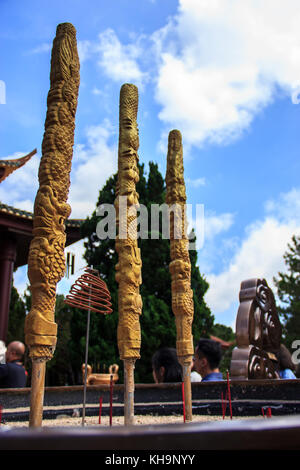 Dragon Joss sticks burnt in the giant pot in front yard of vietnamese temple, Chua Truc Lam, Dalat, Vietnam, Asia. Stock Photo