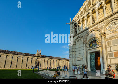 The front of the Duomo, Pisa cathedral with the Campo Santo behind in the Field of Miracles in Pisa Italy Stock Photo