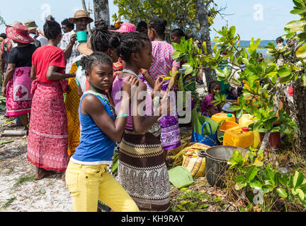 Two young girls at a Zebu sacrifice ceremony, Lake Ampitabe, Toamasina, Madagascar, Africa Stock Photo