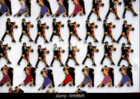 Buenos Aires, Argentina - July 9, 2011: Refrigerator magnets with the image of tango dancers are sold during the tango-feast on the street Stock Photo