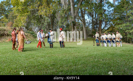 Reenactment of 1700's French soldiers arriving to establish Fort Toulouse, Alabama USA, meeting the native American tribes from the Creek Nation. Stock Photo