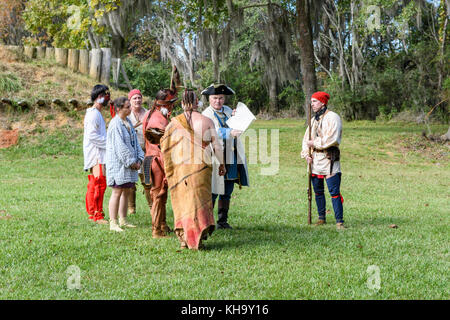 Reenactment of 1700's French soldiers arriving to establish Fort Toulouse, Alabama USA, meeting the native American tribes from the Creek Nation. Stock Photo