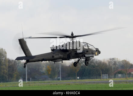 A U.S. Army AH-64 Apache assigned to 1st Air Cavalry Brigade, 1st Cavalry Division, leaves Chièvres Air Base, Belgium, for Germany, Latvia, Romania an Stock Photo