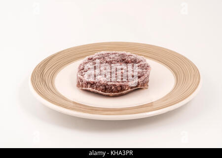 frozen hamburger on a plate Stock Photo